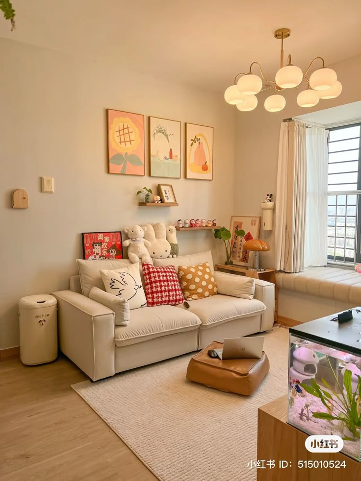 a living room filled with furniture and a fish tank in the middle of the room