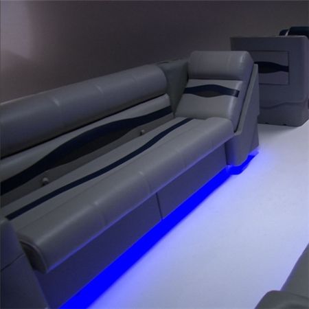 two couches are lit up with blue lights