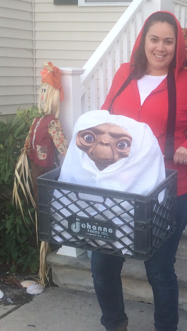 a woman holding a shopping basket with an image of a monkey in the bag on it