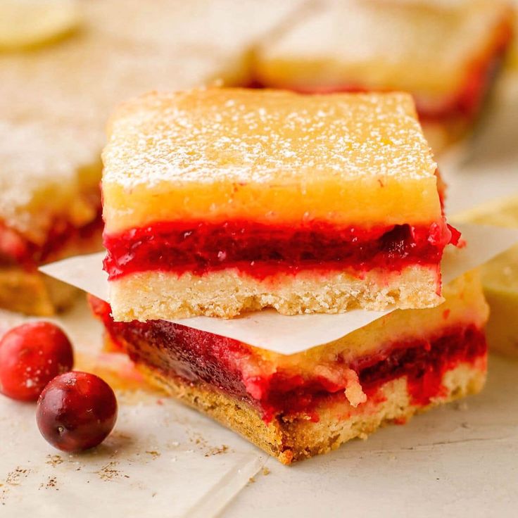 raspberry lemon bars stacked on top of each other