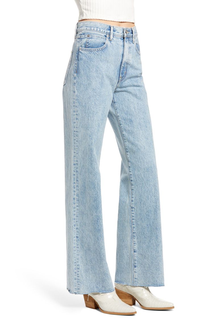 Raw hems refresh the retro style of figure-elongating wide-leg jeans handcrafted in Los Angeles from soft-yet-rigid Italian denim. 32" inseam; 21" leg opening; 12" front rise; 15" back rise (size 29) Zip fly with button closure Five-pocket style 100% cotton Machine wash, tumble dry Made in the USA of imported fabric Women's Clothing Summer Flare Jeans In Rigid Denim With Five Pockets, Modern Flare Jeans In Rigid Denim With Relaxed Fit, Modern Relaxed Fit Light Wash Jeans, Summer Flare Jeans With Five Pockets In Rigid Denim, Modern Relaxed Fit Flare Jeans, Modern High Waist Denim Jeans, Modern High Rise Denim Blue Jeans, Spring Denim Bottoms With Standard Cut Leg, Spring Flare Jeans In Rigid Denim With Standard Cut