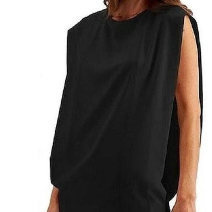 Approx. 32 Long Crewneck Polyester Machine Washable Imported Due To Variances In Monitor Color, And Lighting, The Color Of Some Items May Differ Slightly From The Photographs Black Tank Blouse With Vest Detail, Black Tank Vest Blouse, Black Vest Tank Blouse, Black Stretch Sleeveless Blouse, Chic Black Sleeveless Top, Casual Black Blouse With Vest Detail, Casual Black Blouse With Vest, Casual Black Vest-style Blouse, Black Sleeveless Vest Blouse