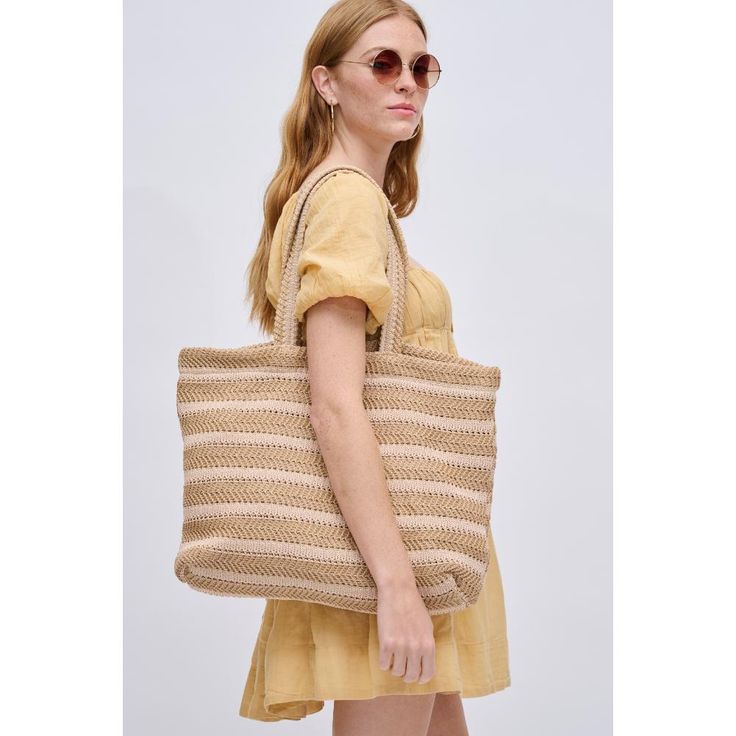 The epitome of laid-back chic, perfect for beach days or farmer's market strolls! With a breezy open closure and a woven all-over exterior featuring a stripe design, this tote effortlessly combines style with functionality. Inside, the printed fabric lining, 1 zip pocket, and 2 slip pockets make it your go-to for a fashionable and organized outing. Embrace the sunshine with a tote designed for those sunny adventures! Item Type: Tote Material: Straw Closure: Open Exterior Details: Woven All-over, Natural Blush, Exterior Details, Festival Wedding, Farmer's Market, Beach Days, Printed Fabric, The Sunshine, Stripes Design, Interior Details