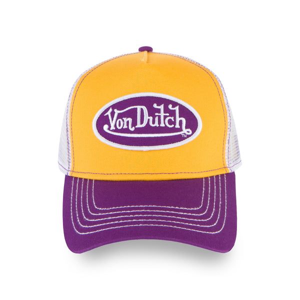 A classic snapback trucker hat by Von Dutch features purple and gold, with iconic logo patch on front, white breathable mesh rear, and an adjustable snapback panel. Purple and gold trucker cap Von Dutch logo patch Breathable mesh rear Curved bill Adjustable snapback panel One size fits most *ALL TRUCKER/HEADWEAR SALES Trucker Hat With Logo Patch And Curved Visor, Retro Mesh Trucker Hat, Trendy Snapback Hat With Logo, Retro Trucker Hat With Embroidered Logo And Curved Bill, Retro Trucker Hat With Curved Visor For Baseball Season, Logo Trucker Hat With Curved Visor For Streetwear, Logo Trucker Hat For Streetwear With Curved Bill, Streetwear Trucker Hat With Curved Visor And Logo, Streetwear Mesh Snapback Hat With Logo Patch