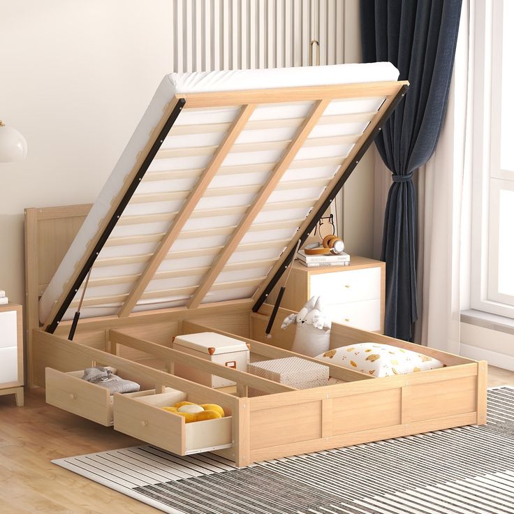 an open storage box on the floor in a room with a rug and window behind it