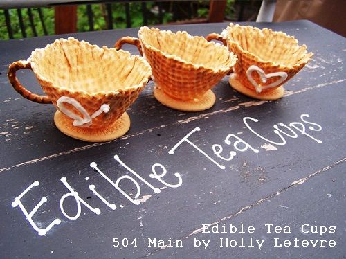 three teacups sitting on top of a table with the words edible tea cups