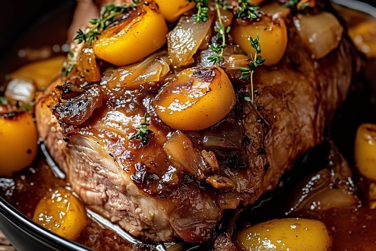 a close up of a plate of food with meat and potatoes