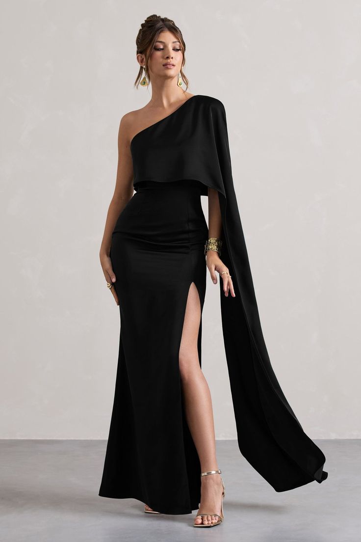 Special occasions warrant a truly statement piece like Amora, our asymmetric maxi dress. Cut in a classic black shade of our signature satin, this floor-sweeper is defined by a single cape sleeve and tantalising high-leg split. For a timeless wedding guest ensemble, compliment Amora with some glistening gold accents.Features - Premium satin- One shoulder neckline - Single cape sleeve- Invisible zip closure - High-leg split- Maxi length Sizing & Fit Model is 5'7 and wears UK size 8 / US size 4Product Information Designed exclusively by Club L London Unlined with no stretch Premium satin in Black (100% Polyester) 157cm total length SKU: CL134678002 Black Tie Event Dresses, Leg Split, Black Dress Prom, Black Tie Gala, Guest Attire, Wedding Attire Guest, Split Maxi Dress, Cape Sleeves, Black Tie Wedding