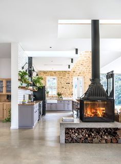 an instagram page with a fireplace and kitchen in the background