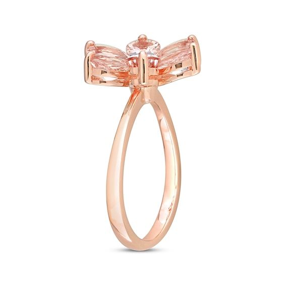 This blushing ring displays an array of peachy pink, pear-shaped morganites arranged to resemble flower petals. A bezel-set diamond accent glimmers at the center for a touch of sparkle. The ring is crafted in pretty 10K rose gold. Formal Pink Flower-shaped Rings, Rose Gold Cubic Zirconia Flower Ring For Formal Events, Elegant Pink Oval Flower Ring, Formal Fine Jewelry Blush Rings, Formal Pink Flower Shaped Ring, Elegant Pink Cubic Zirconia Flower Ring, Pink Gemstone Flower Ring For Formal Occasions, Formal Pink Gemstone Flower Ring, Rose Gold Flower Ring With Halo Setting