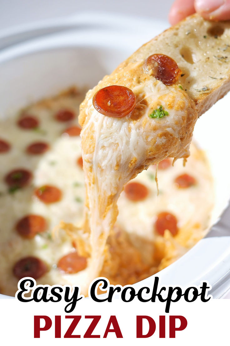 a close up of a piece of pizza being lifted from a casserole dish