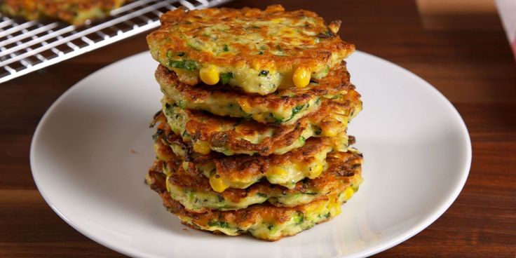 a stack of food sitting on top of a white plate next to a cooling rack