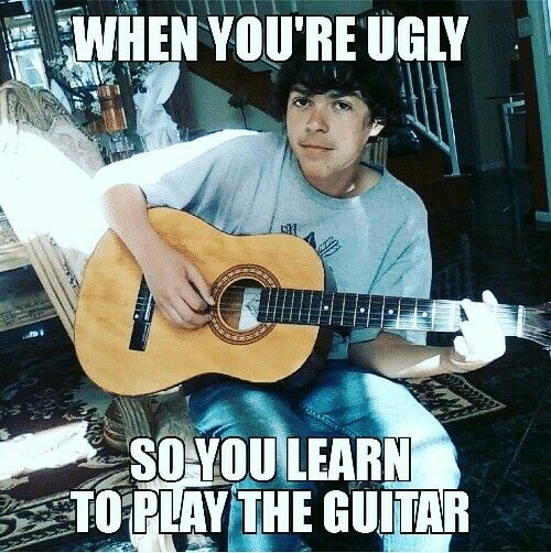 a young man sitting on a chair holding an acoustic guitar with the caption, when you're ugly so you learn to play the guitar