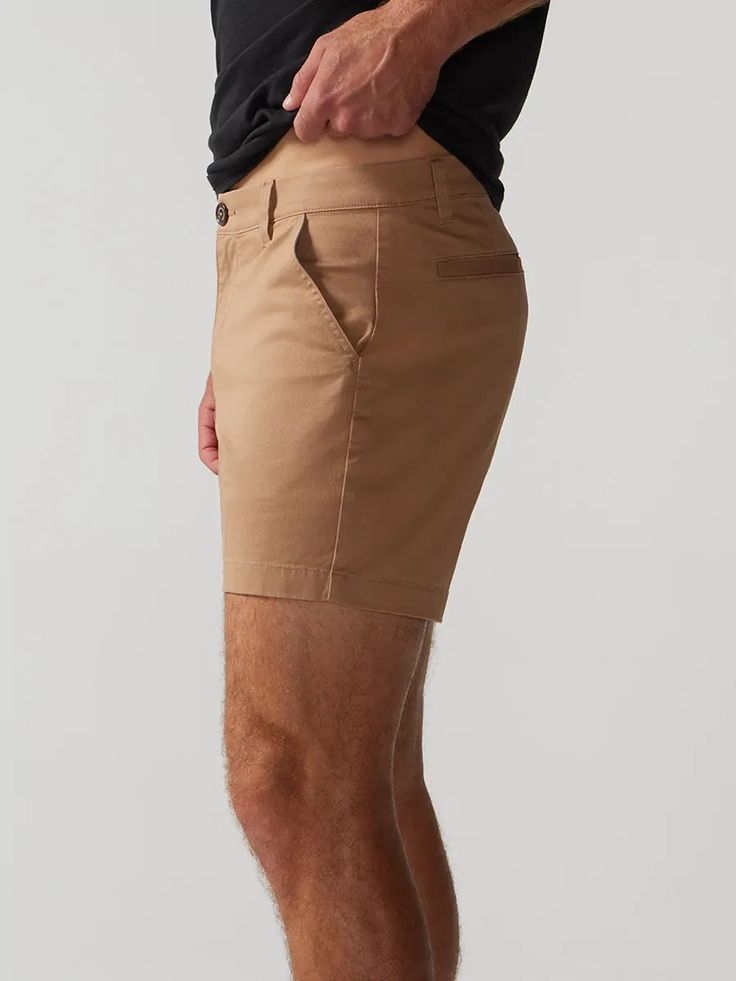 Built for those classy moments where you gotta dress your casual shorts up. Made with our classic Originals spandex stretch fabric in a classier, more tailed fit, the Flat Front shorts are designed to give you that elevated chino look without sacrificing comfort. They rock a non-elastic waistband and oxford lined pockets, so whether you're headed to the golf course or a casual lunch meeting, you can feel confident that all of your necessities are safe and secure. Fabric: 98% cotton / 2% spandex Fitted Shorts With Pockets And 5-inch Inseam, Classic Stretch Bottoms With Built-in Shorts, Classic Bermuda Shorts With Built-in Shorts, Slim Fit Bottoms For Business Casual Summer, Slim Fit Bottoms For Summer Business Casual, Summer Business Casual Slim Fit Bottoms, Fitted Cotton Bermuda Shorts For Work, Slim Fit Summer Bottoms Short Length, Slim Fit Summer Shorts