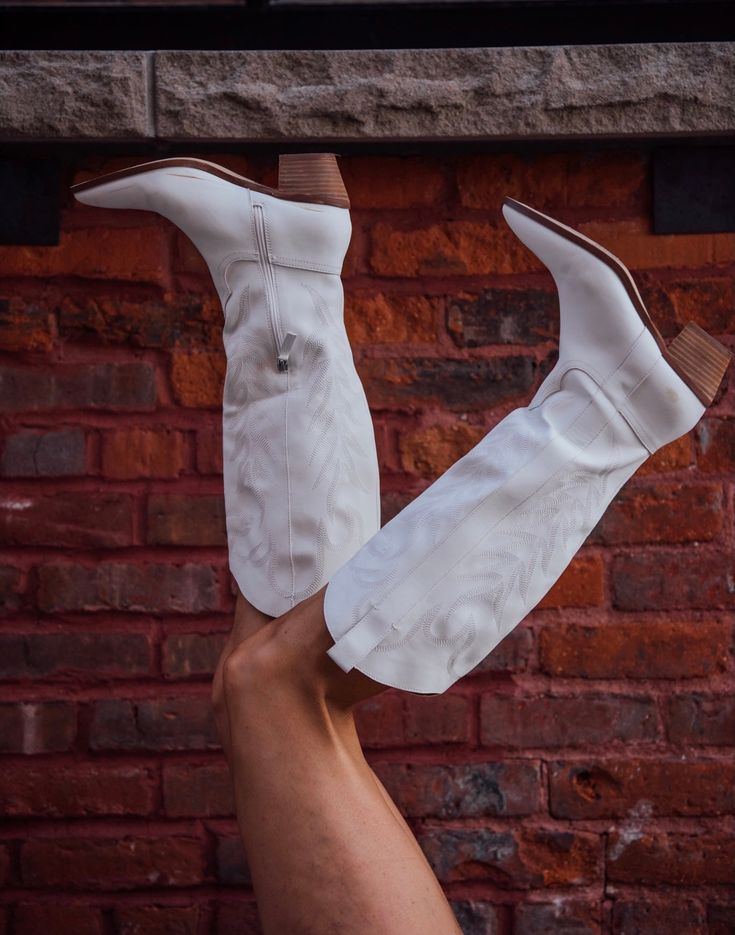 The hottest trend of 2022 are white boots no doubt and these fit the bill. Man made upper. Leather wrapped heel. Shaft height is 13.75". Heel height is 2.5". Half zip closure. Boot opening is 15" circumference. Running true to size. If you toggle between two sizes, go with your larger size. Casual White Knee-high Boots For Spring, White Western Knee-high Boots With Wide Calf, White Western Heeled Boots With Wide Calf, White Wide Calf Western Knee-high Boots, Western White Heeled Boots Wide Calf, White Western Wide Calf Heeled Boots, White Western Heeled Boots For Wide Calves, Wide Calf White Knee-high Boots For Winter, Winter Wide Calf White Knee-high Boots