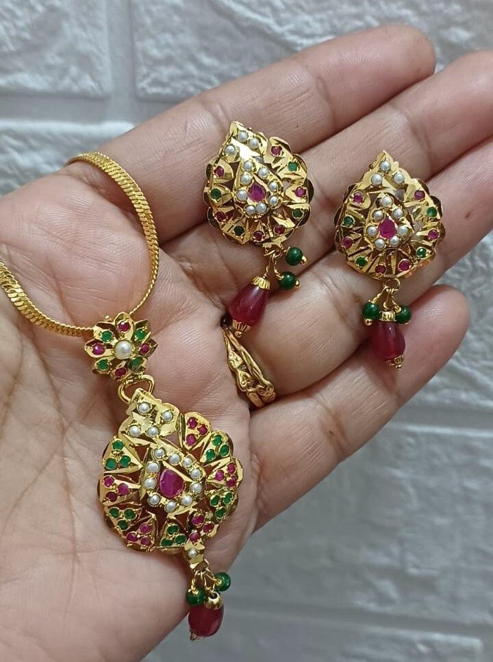 24K Gold plated adorable jadau multi color necklace set by our multi talented craftmen made with craftmenship. Elevate yourself with a unique design. Multicolor Temple Necklace As Gift, Multicolor Hand Set Jewelry Sets As Gift, Multicolor Kundan Pendant Necklace As Gift, Multicolor Handmade Kundan Necklace Gift, Multicolor Hand Set Temple Jewelry Sets, Multicolor Kundan Temple Necklace As A Gift, Multicolor Hand Set Jewelry Sets For Gifts, Celebration Multicolor Kundan Necklace Gold Plated, Handmade Multicolor Kundan Necklace Gift