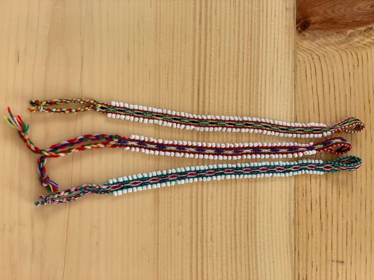 "Multi-colored and  beautiful, Andean watana tie specifically made as a bracelet. Each bracelet is finished with beading and tassels / loop to ensure  an easy tie.  9.5in length x 0.375\" width" Adjustable Handwoven Braided Bracelets, Multicolor Multi-strand Friendship Bracelets For Beach, Multicolor Beaded Friendship Wrap Bracelet, Adjustable Woven Multicolor Wrap Bracelet, Adjustable Colorful Beads Wrap Bracelet, Adjustable Multicolor Beaded Friendship Bracelets, Adjustable Woven Braided Bracelet With Round Beads, Adjustable Multicolor Beaded Bracelet For Festival, Adjustable Braided Bracelets With Colorful Beads For Friendship