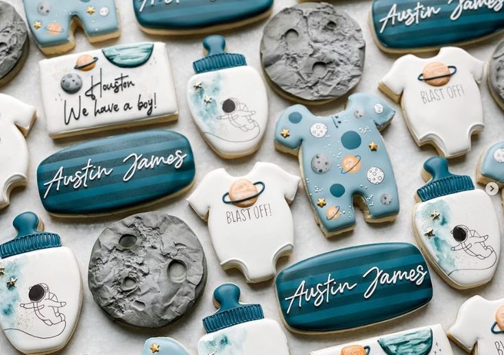 some cookies that are decorated with baby items