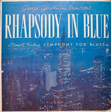 an album cover with the words rhapsody in blue on top of a cityscape