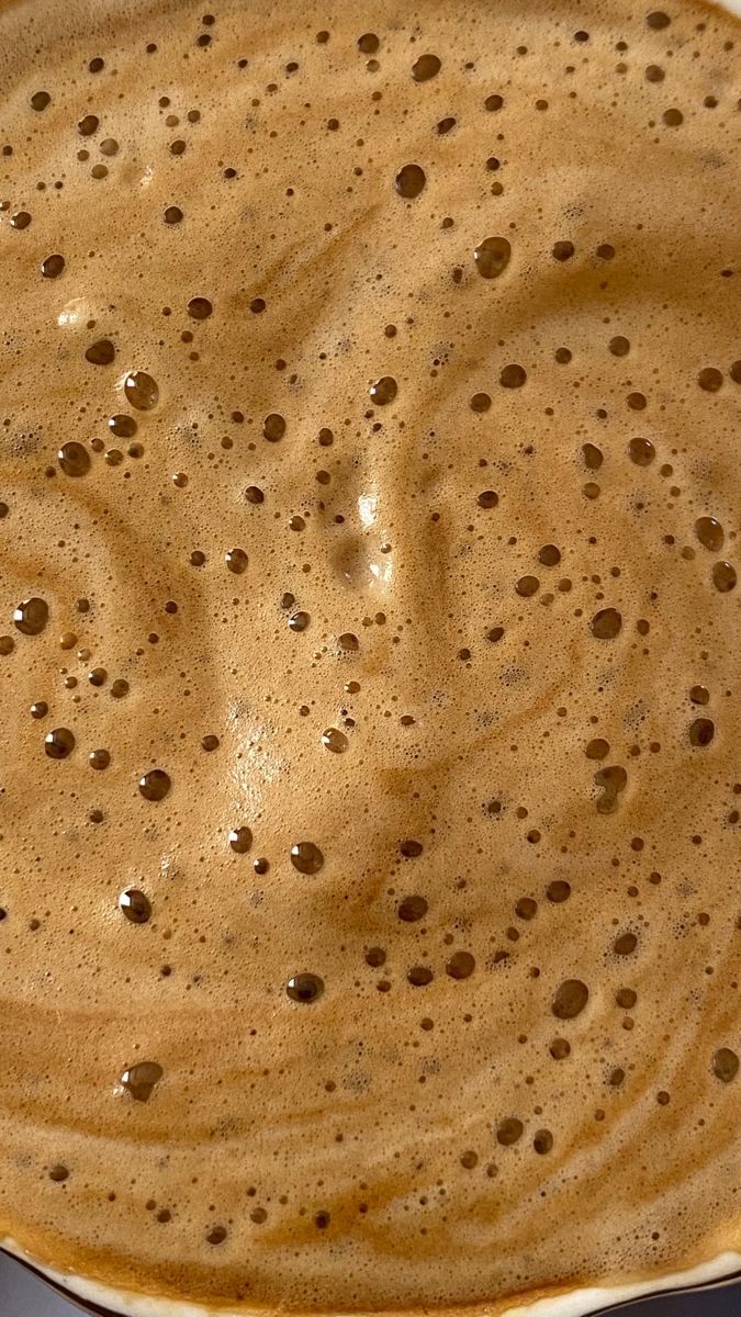 a pan filled with liquid sitting on top of a stove