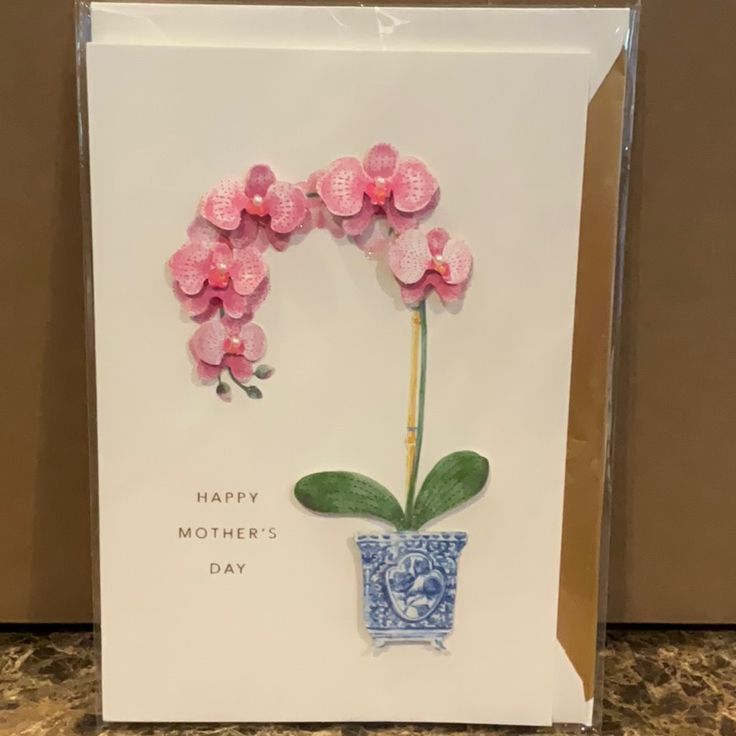 a mothers day card with pink flowers in a blue vase