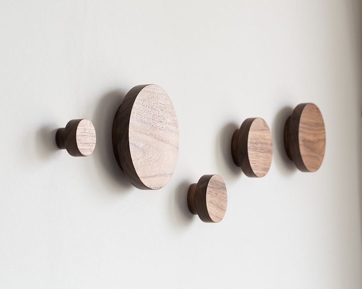 three wooden circles hang on the wall