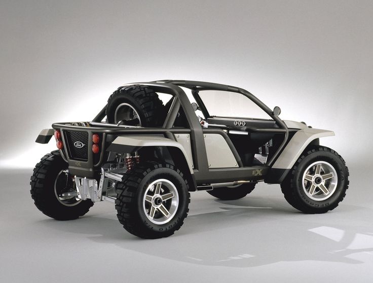 an off - road vehicle is shown in this studio photo, with the doors open