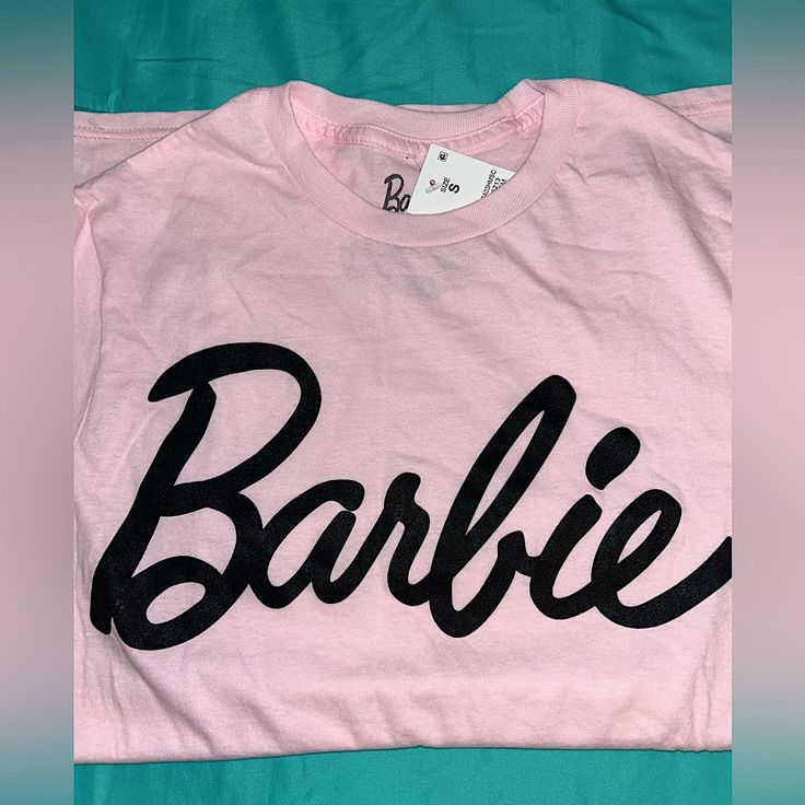 Official Tee For Barbie! Size S New Real & Genuine Pink Slogan Crew Neck Shirt, Pink Slogan Shirt With Crew Neck, Pink Crew Neck Shirt With Slogan, Trendy Pink Shirt With Text Print, Trendy Pink Shirt With Letter Print, Pink Graphic Tee Shirt With Logo Print, Barbie Merch, Red Valentine, Fan Girl