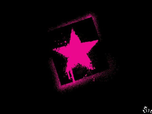 a pink star on a black background