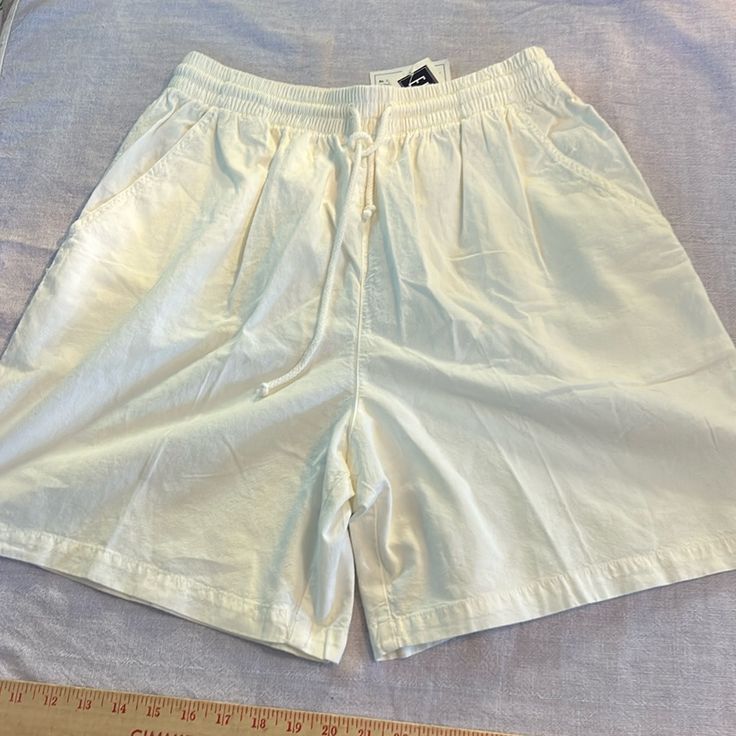 Nwt Great White Shorts, One And Three-Quarter Inch Waistband With Elastic And Workable Drawstring. Front Pockets. Never Been Worn. Size Large. Waist 16 Inches. Inseam 7 Inches. Rise 15 Inches. And The Length From Waist To Hem 20 Inches. The Unique Nature Of This Clothing Is That It Has Been Garment Died. The Soft Well Worn Look Has Slight Color Shadings As Part Of Its Characteristics. Leisure Short Summer Pants, White Leisure Bottoms For Summer, Bermuda Bottoms For Spring Leisure, Leisure Bermuda Bottoms For Spring, Spring Bermuda Leisure Bottoms, White Bermuda Pants For Summer, White Short Pants With Elastic Waistband, White Bermuda Bottoms For Loungewear, Cream Beach Bottoms With Elastic Waistband