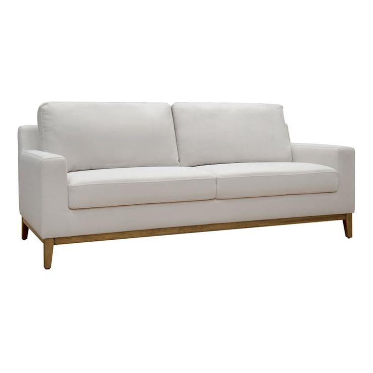 a white couch sitting on top of a wooden frame