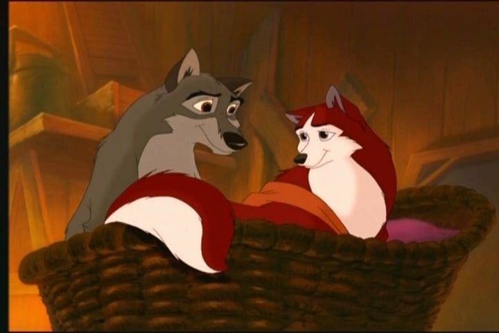 the fox and the hound are sitting in a basket