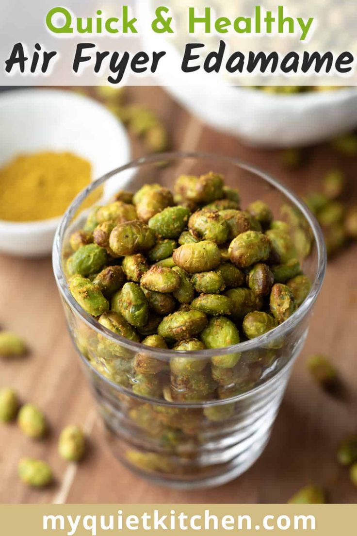 a glass bowl filled with green sprouts and spices