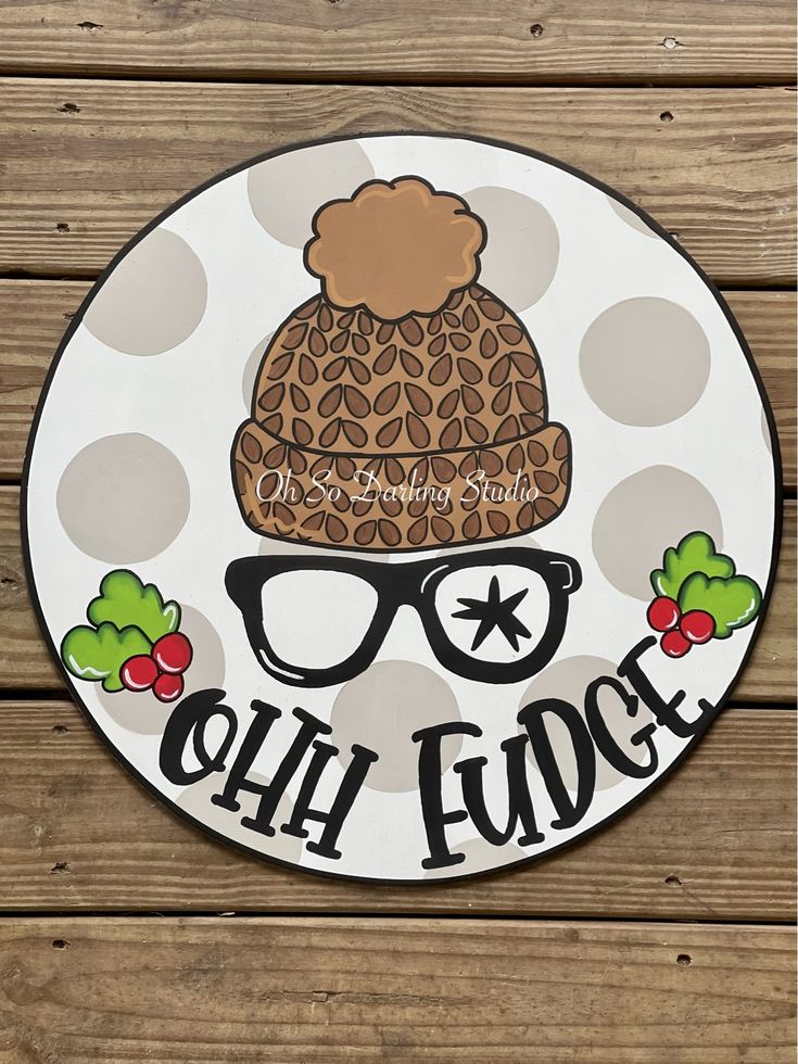 a sign that says, ohh edge with glasses and a beanie on it