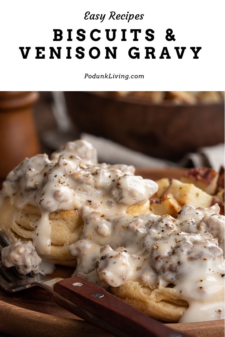 biscuits and venison gravy on a plate with a fork next to it