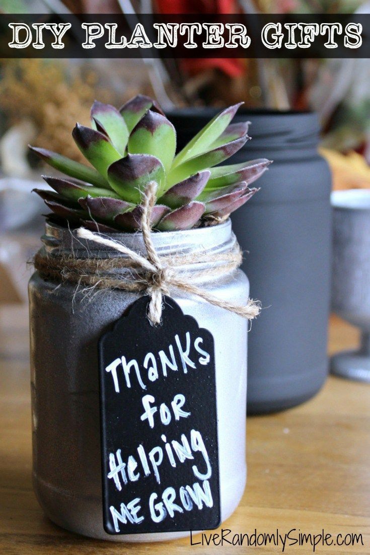 a mason jar filled with succulents and a sign that says thanks for helping me grow