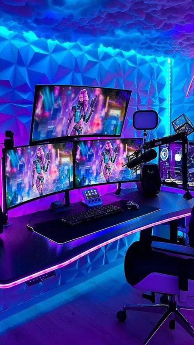 a computer desk with three monitors on top of it in front of a purple and blue background