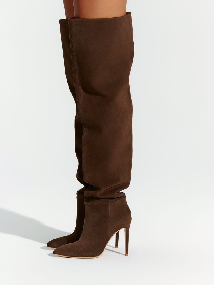 The ultimate statement boot with two-in-one versatility. Crafted from premium Italian leather and a suede finish, with a pointed toe, and stiletto heels. Available in black, chocolate brown, and dark grey tones. Wear them tall or create a slouchy look. Boots Collection Italian leather sole & inner-top-lining Imported Suede Stiletto heel Heel height: 4" True to size. Full sizes only - please size up if needed. Model is wearing size 38 Please note: Returns for shoes are accepted up to 15 days afte Suede Thigh High Boots, Black Suede Thigh High Boots Outfit, Size 12 Shoes For Women, Over The Kneww Boots, Tan Over The Knee Boots, Brown Boots Heels, Style Rain Boots, Long Boot Heels, Fall Footwear 2024