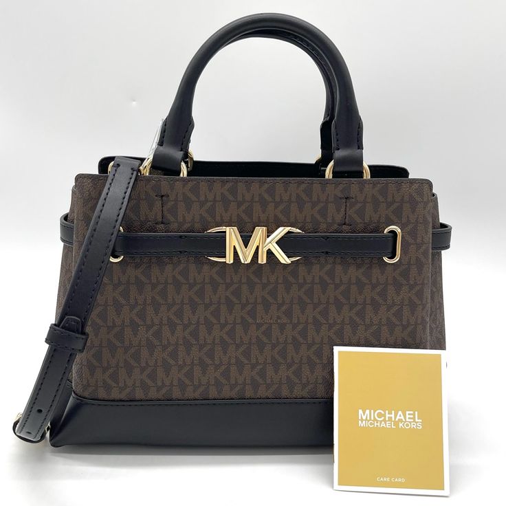 Brand New With Tag Michael Kors Reed Small Satchel Crossbody Bag Satchel Color: Brown/Black Logo-Print Canvas/Faux Leather 74% Coated Canvas/19% Polyester/7% Polyurethane Trim: 60% Polyurethane/20% Cotton/20% Polyester Gold-Tone Hardware 10.5”W X 7.5”H X 4.25”D Handle Drop: 4” Adjustable Strap: 18.5”-22.25” Interior Details: Back Zip Pocket, Front Slip Pocket Lining: 100% Polyester Zip Fastening Dust Bag Not Included Imported Brown Double Handle Shoulder Bag With Logo, Chic Brown Bag With Logo, Brown Satchel Bag With Logo, Brown Logo Satchel For Travel, Rectangular Brown Satchel With Logo, Brown Rectangular Satchel With Logo, Michael Kors Top Handle Shoulder Bag With Logo, Michael Kors Evening Bag With Logo, Brown Top Handle Satchel With Logo