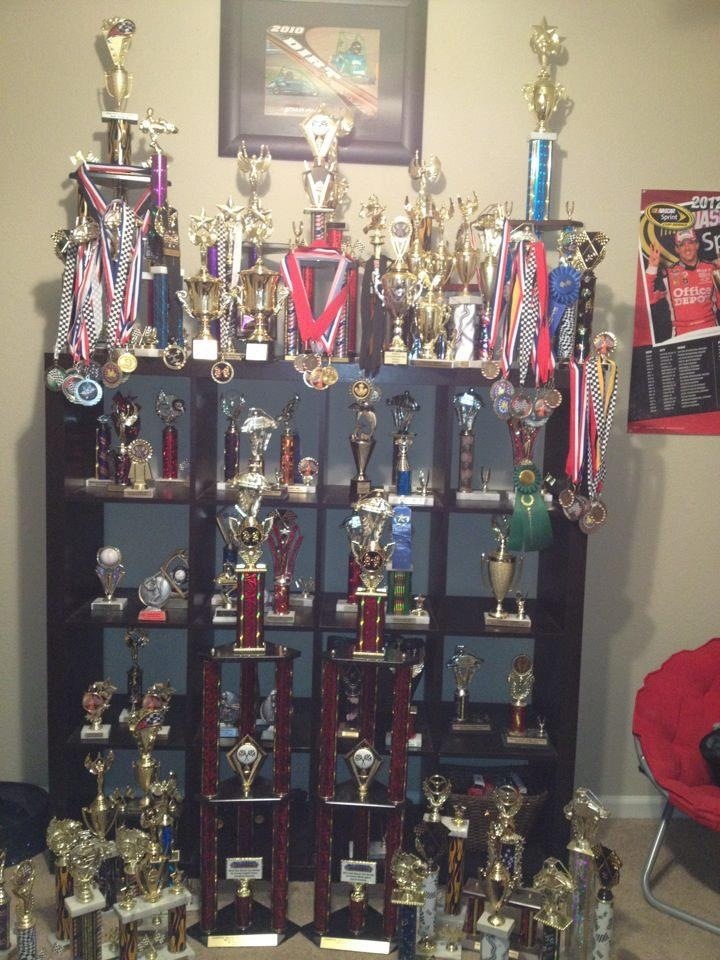 a large display case filled with lots of trophies