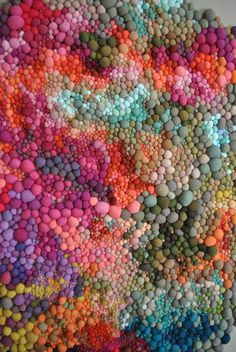 an art work made out of various colored pebbles