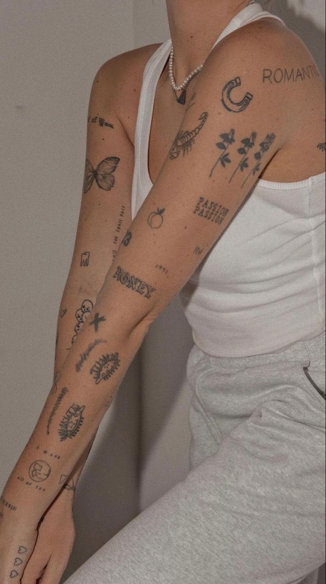 a woman with many tattoos on her arm