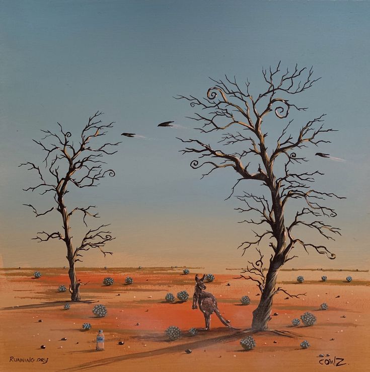 two dead trees in the desert with birds flying over them and one man on horseback