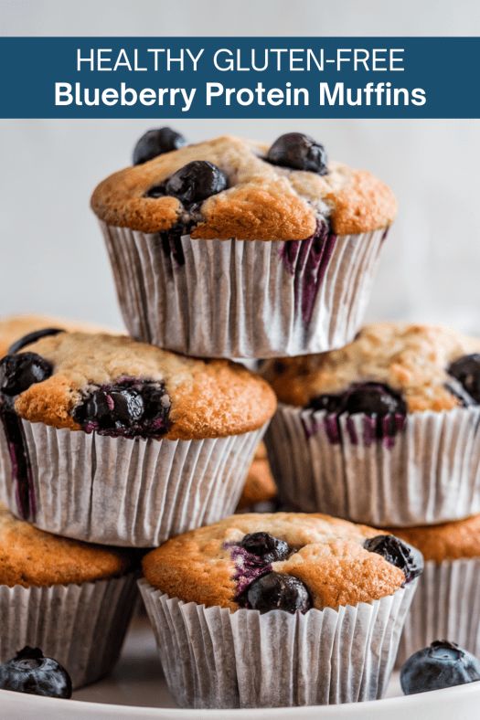 blueberry muffins stacked on top of each other with text overlay reading healthy gluten - free blueberry protein muffins