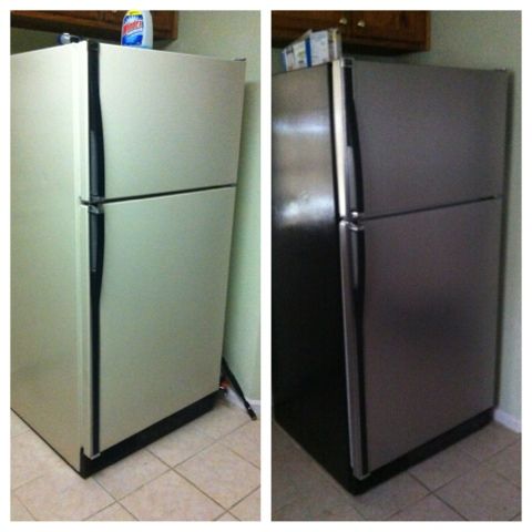 two refrigerators side by side in a kitchen with tile flooring and white walls