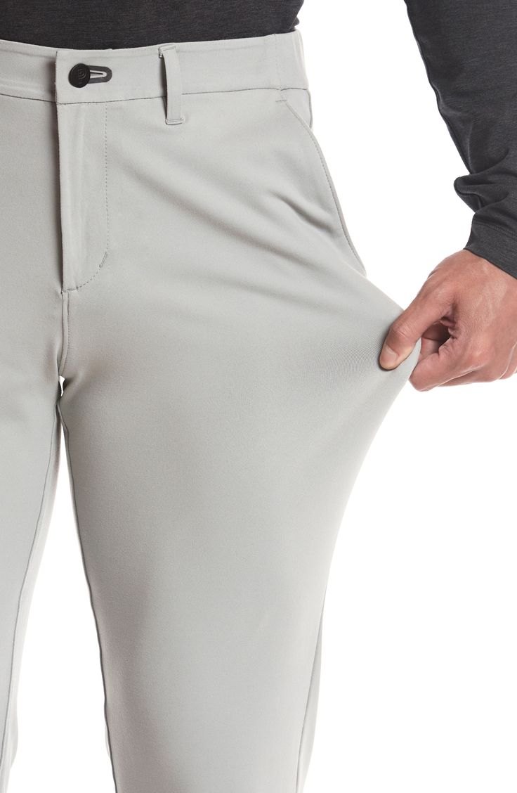 Stay comfy on or off the course in nylon performance pants built with stretch and a roomier fit that slightly tapers off at the ankle. The secure zip pocket helps safely store smaller essentials so you can keep your focus on the game. Zip fly with button closure Front slant pockets; hidden side-zip pocket; back welt pockets 88% nylon, 12% spandex Machine wash, tumble dry Imported Functional Moisture-wicking Bottoms For Golf, Stretch Moisture-wicking Golf Bottoms, Moisture-wicking Stretch Golf Bottoms, Navy Chinos, Grey Chinos, Led Fashion, Leather Label, Golf Pants, Khaki Chinos