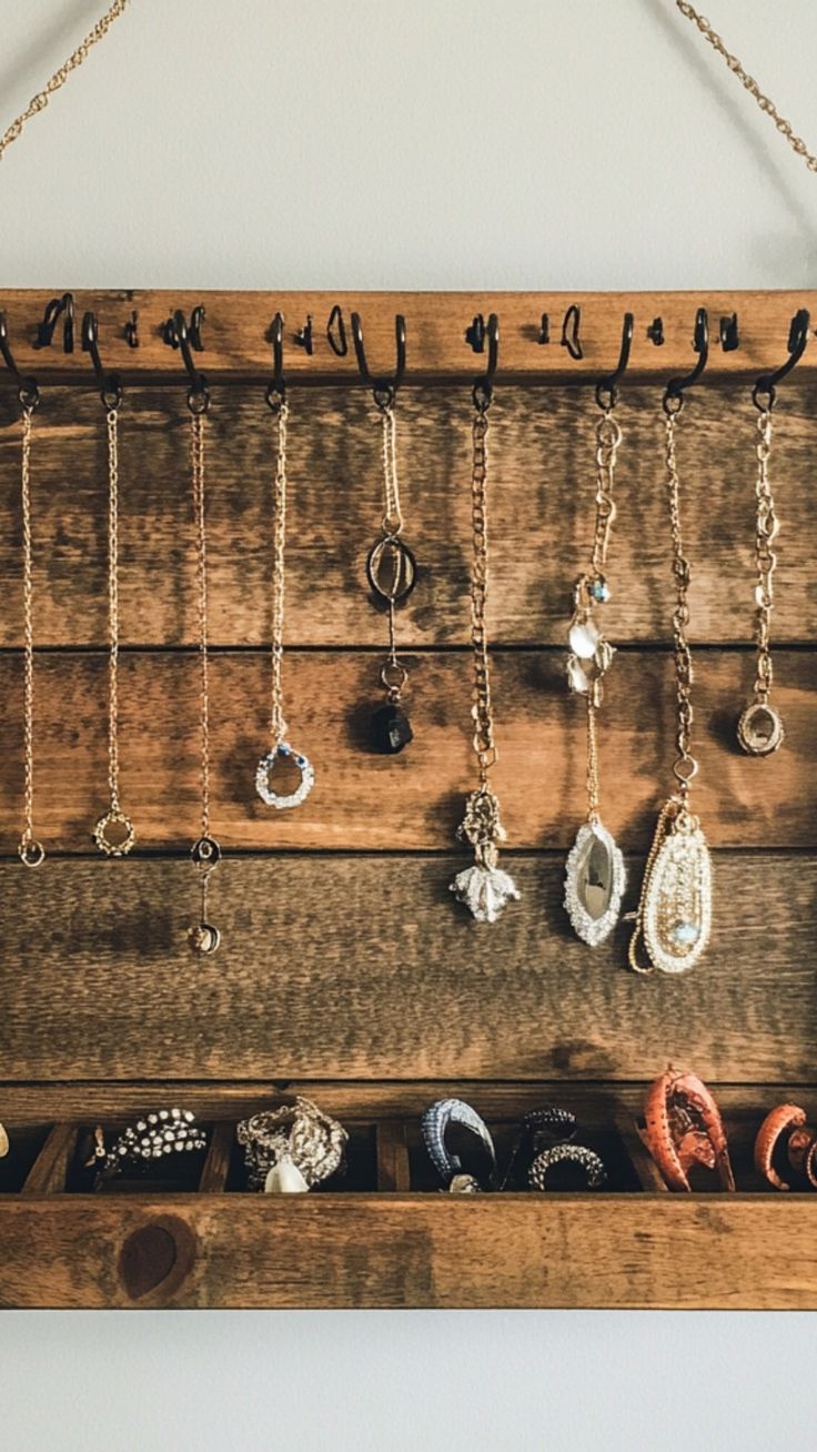 Keep your jewelry organized and tangle-free with this DIY jewelry organizer! Using simple materials like wood, hooks, or even repurposed frames, you can create a stylish display that adds character to your room while keeping your accessories in order. Perfect for creating a personalized, functional storage solution! ✨💍 #DIYJewelryOrganizer #CreativeStorage #HomeOrganization #DIYProjects Homemade Necklace Holder, Wall Jewelry Organizer Diy, Diy Jewelry Wall Display, Homemade Jewelry Holder, Jewelry Organizer Ideas, Diy Jewelry Wall, Diy Jewelry Stand, Jewelry Wall Display, Diy Necklace Holder