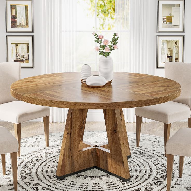 a round wooden table with chairs around it