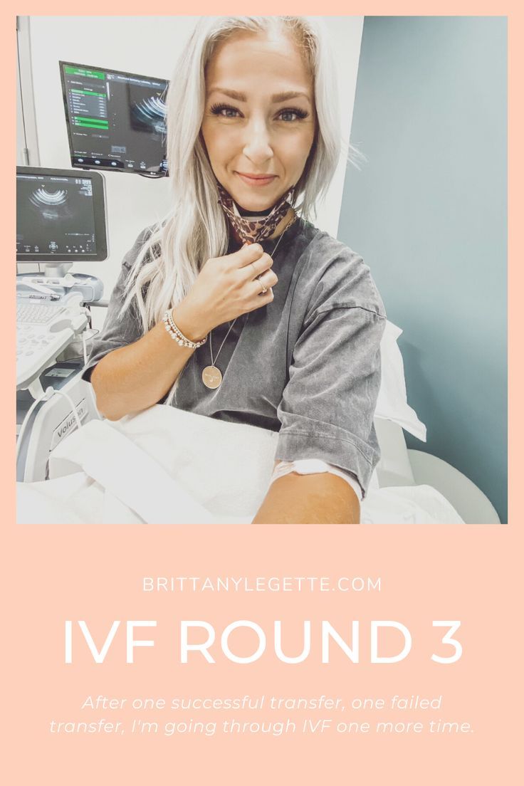 a woman sitting in a hospital bed with her hands on her chest and the words ivf round 3