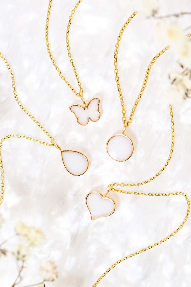 Embrace the beauty of a cherished memory with the Liquid Gold Drop Petite Charm, a delicate and timeless addition to any bracelet or necklace. This petite charm features a teardrop design, reminiscent of a glistening drop of liquid gold, and offers a special way to hold a treasured piece of your story close. Personalize with: Breastmilk - A cherished symbol of the mother-child bond.Cremation ashes - Honor the memory of a loved one.Placenta - Celebrate the miracle of life.Umbilical cord - Symbolize a special connection.Dried flowers - Add a sentimental touch.Hair - Keep a piece of someone close. A unique and sentimental gift for: Mothers celebrating motherhoodNew parents commemorating a birthAnyone who has experienced loss Inclusions: The inclusion bezel can be filled with a variety of mate